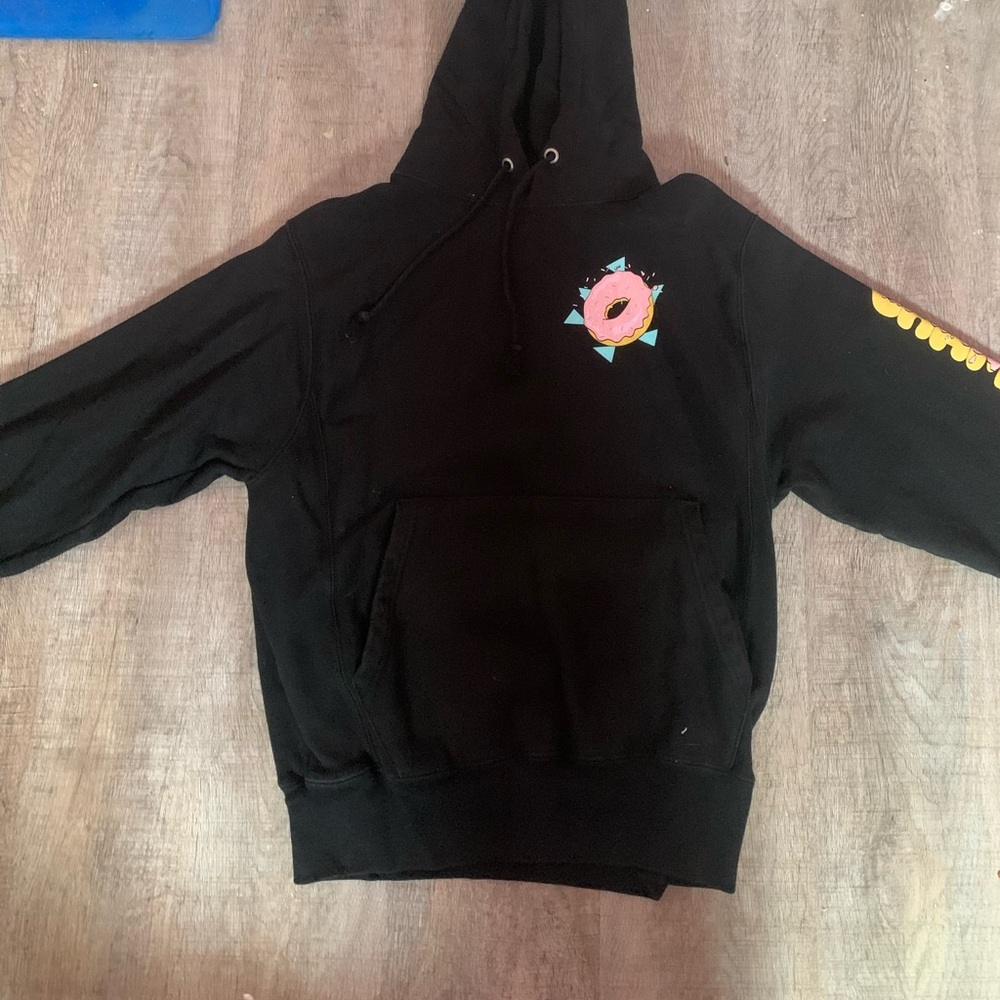 A black champion hoodie, with donut designs